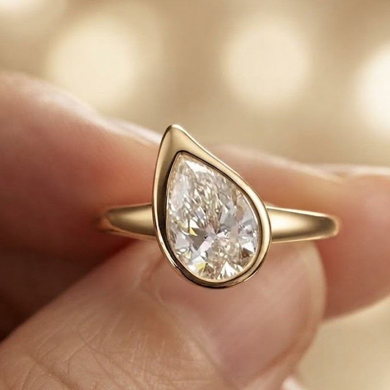 1.90 CT Pear Cut Moissanite Bezel Set Engagement Ring in 14K Yellow Gold Plated