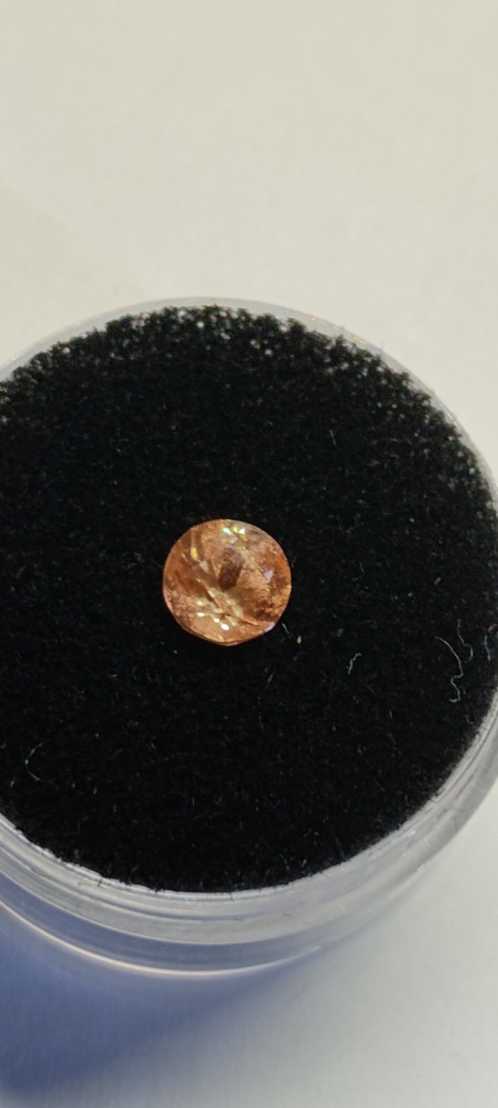 peach schiller faceted Oregon Sunstone 0.80 carat 5.4mm round found & cut in USA