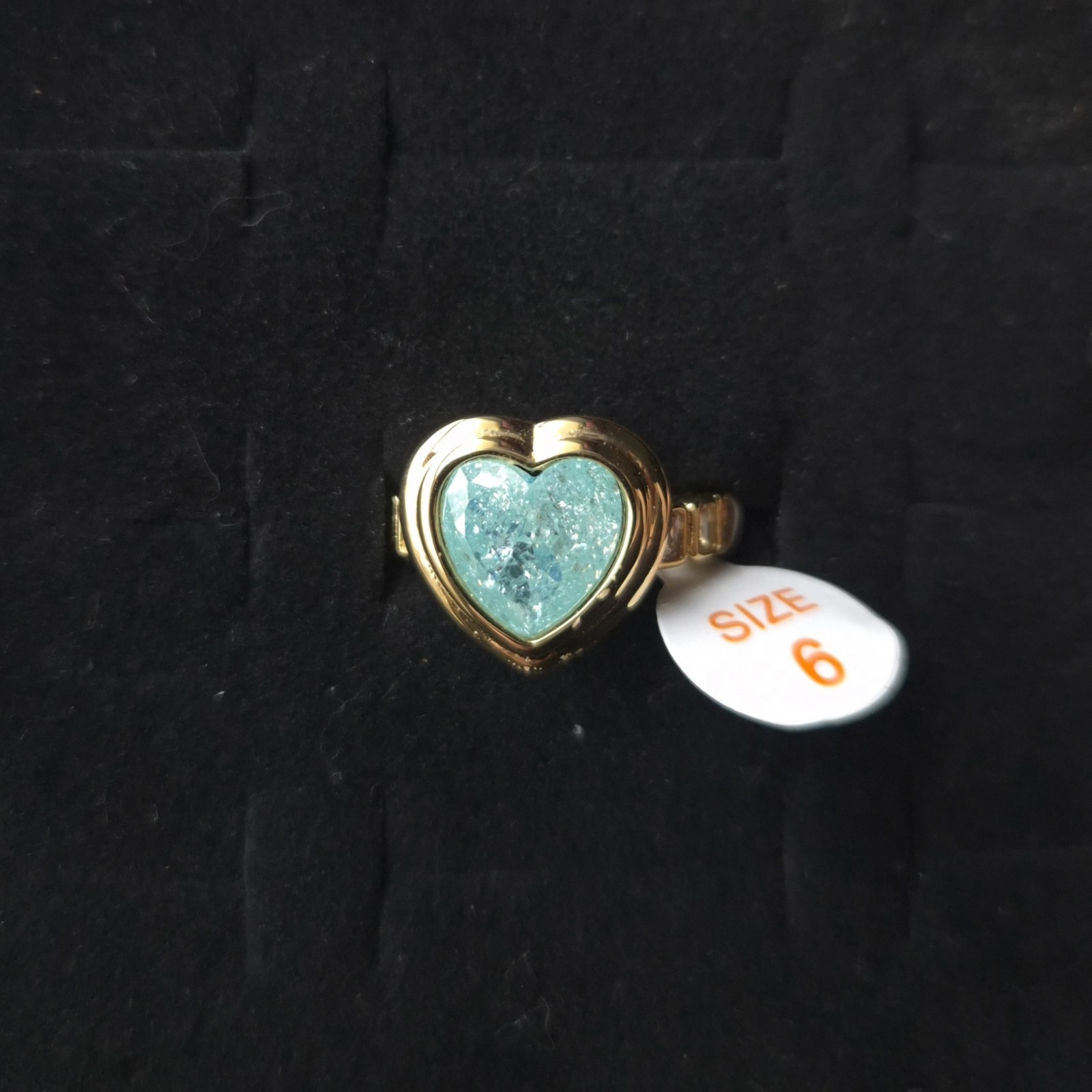 Bomb Party Slow Burn Soft Shine Size 6 In Gold With Blue Topaz Ice Heart