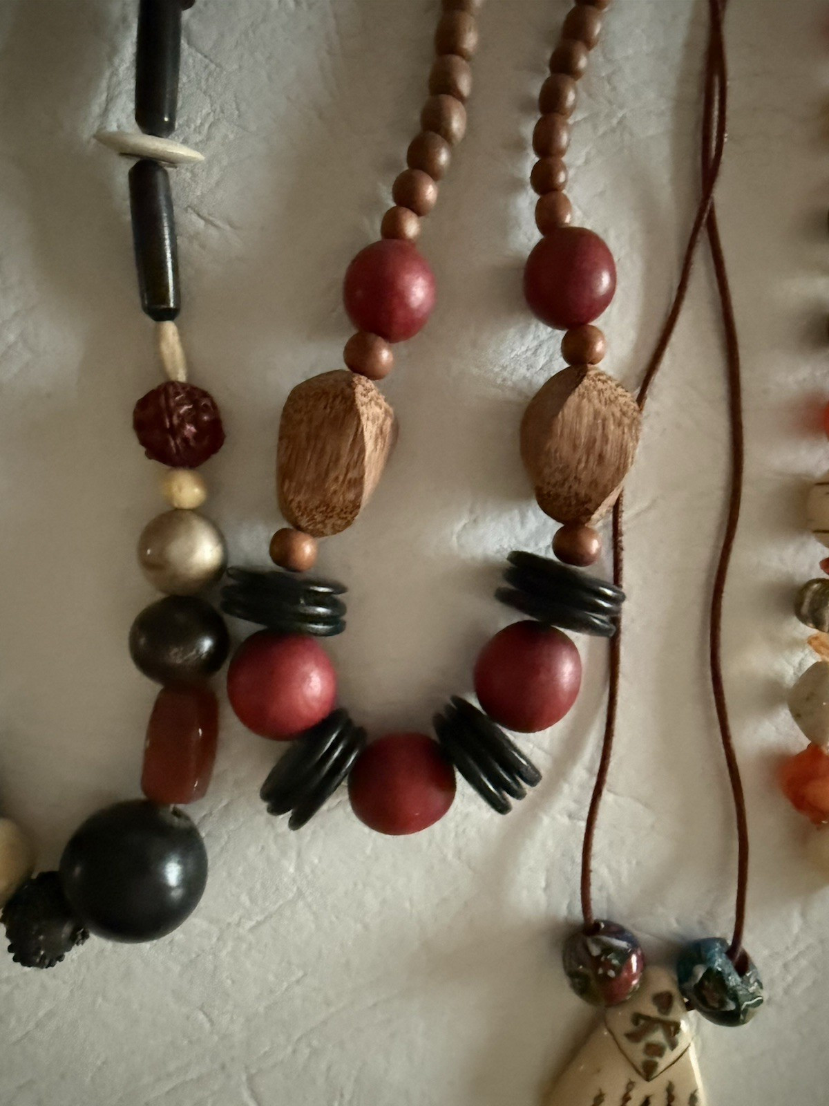 Lot of 10 necklaces, mostly wood beads, some Lucite, ethnic look earth tones