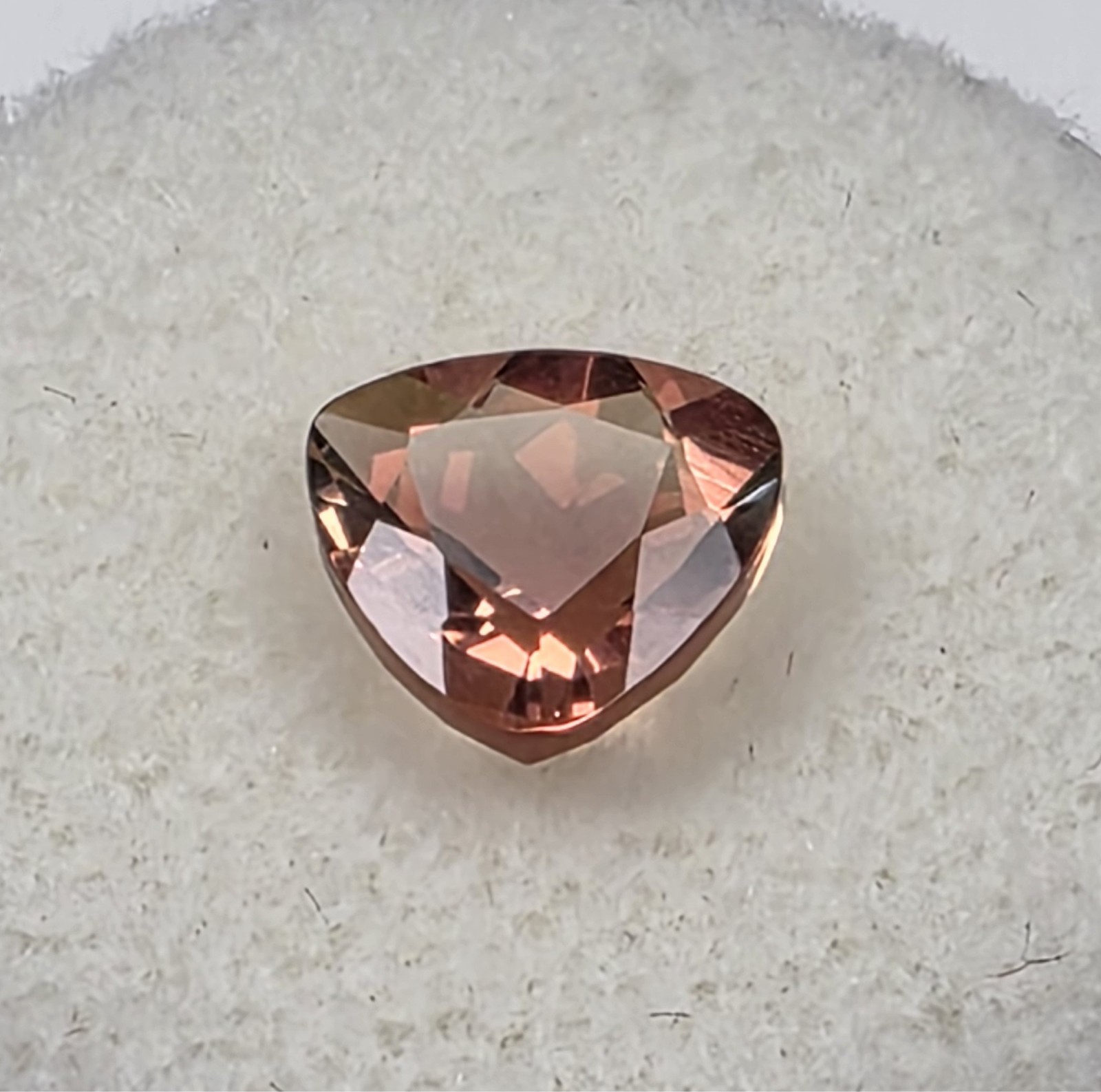 1.72 ct Oregon Sunstone –Trillion Cut – Reddish Orange Color Center Under Table