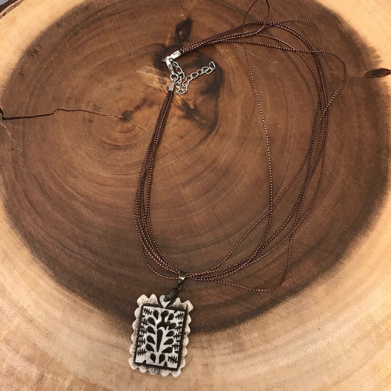 Rectangular Fluted Bone Pendant on a Bronze Tone Polyester Multi Cord Necklace