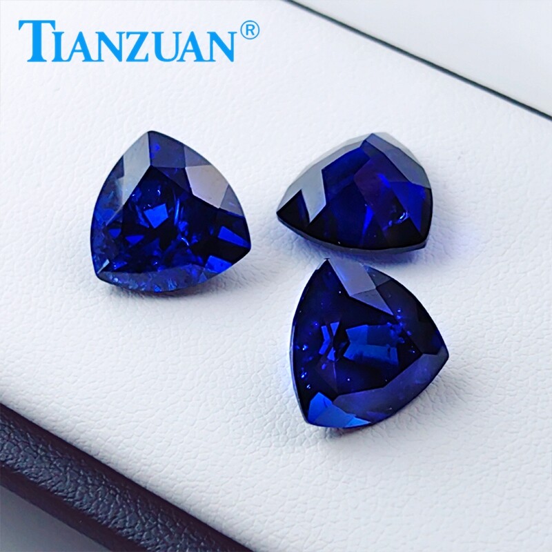 Lab Created Trillion shape Royal Blue Sapphire loose gemstone with Inclusions