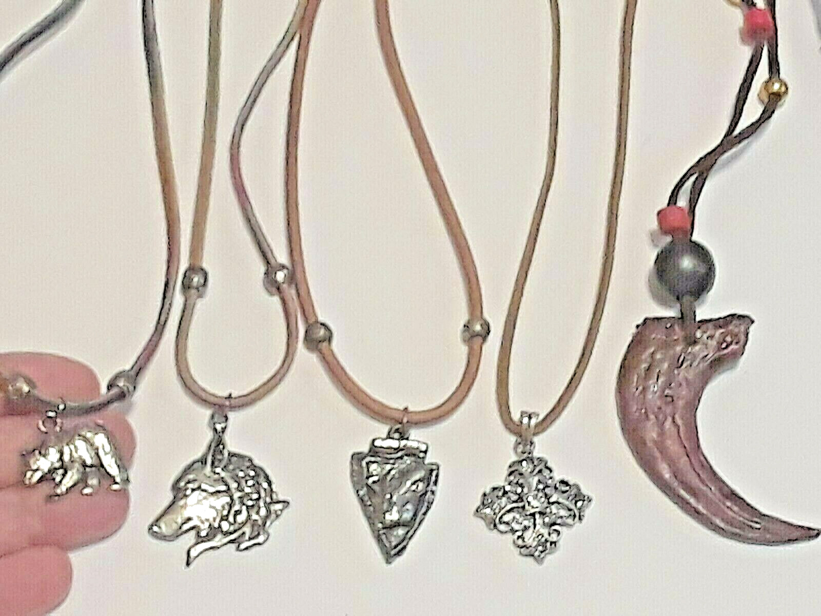 Animal shape pendants silver tone on leather rope chains 18″ long. 5 necklaces