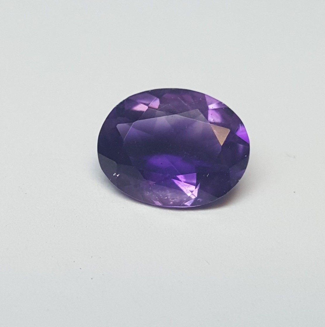 Oval shaped amethyst. 10x8mm oval shaped faceted purple genuine amethyst.