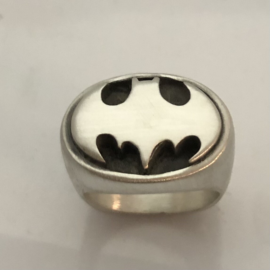MJG STERLING SILVER OVAL BATMAN RING. STARTS AT SIZE 10