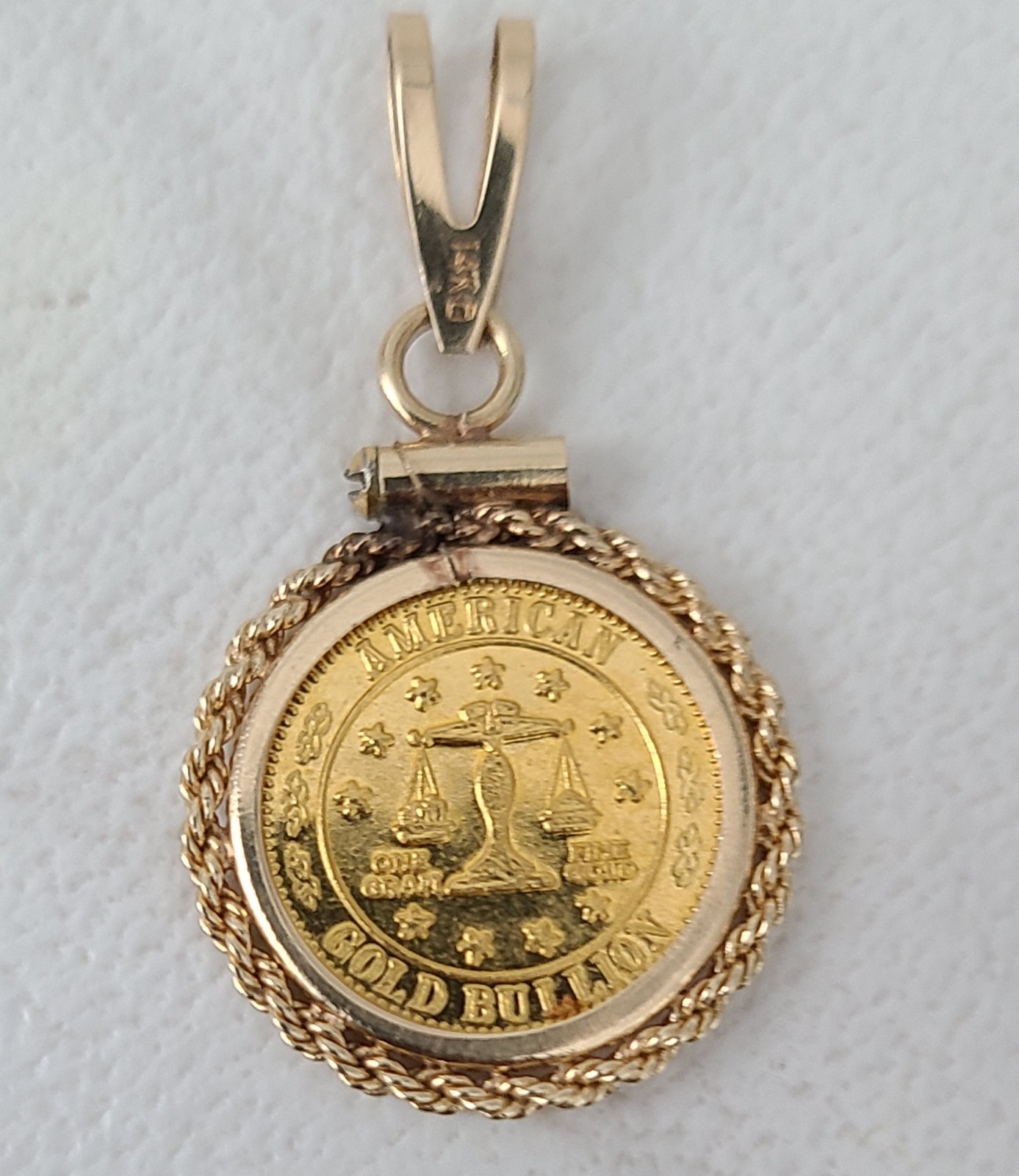 14 K Bezel With A Pure Gold Coin Charm 2.4 grams