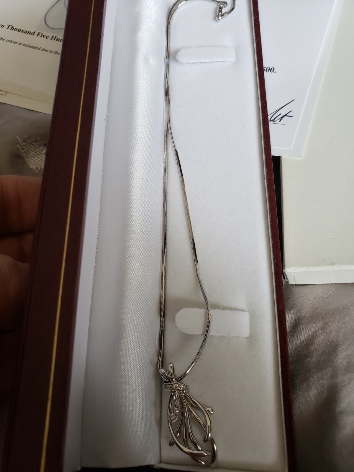 14Kt WHITE GOLD PENDANT WITH DIAMONDS AND 14Kt 18 1/4 INCH WIDE BEVELED CHAIN.