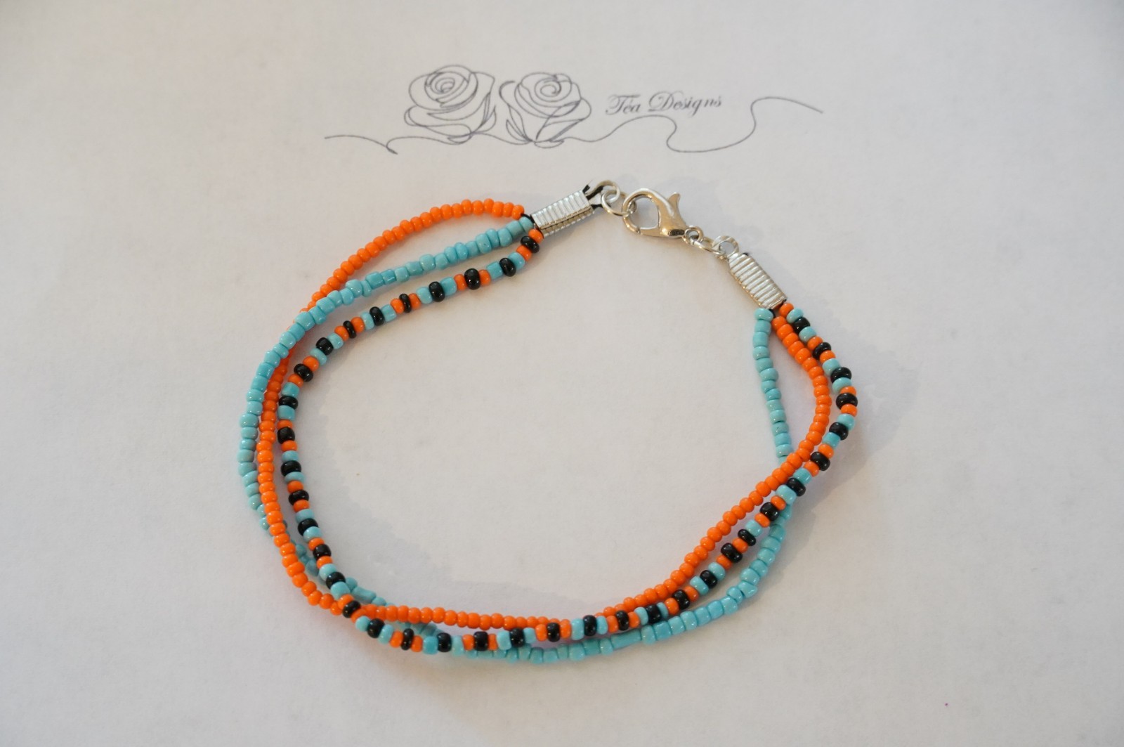 Multi-color Black, Blue, & Orange Glass Seed Bead 8″ Bracelet