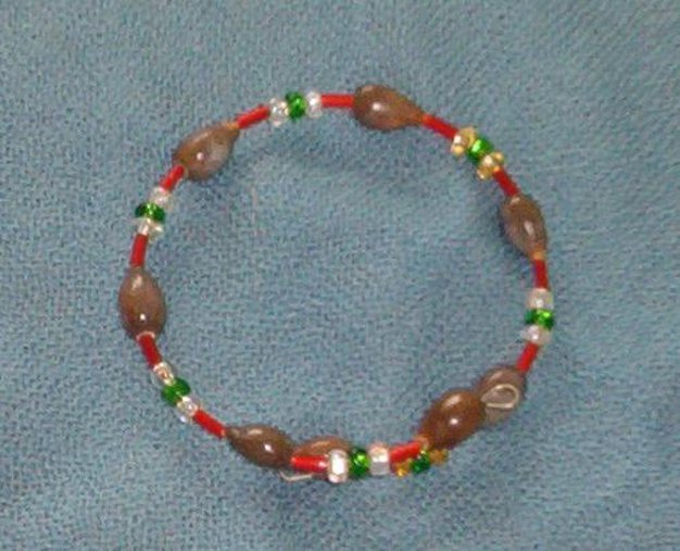 Brown Hawaiian Job’s Tears bracelet with silver lined seed beads red green gold