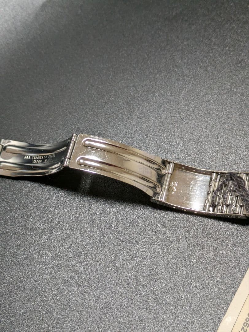 SEIKO stainless steel simple metal band with tag.