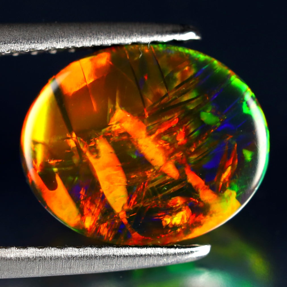 2.19 ct World class Oval Cabochon(11.12 x 9.05 mm)Ethiopian Flashing Black Opal