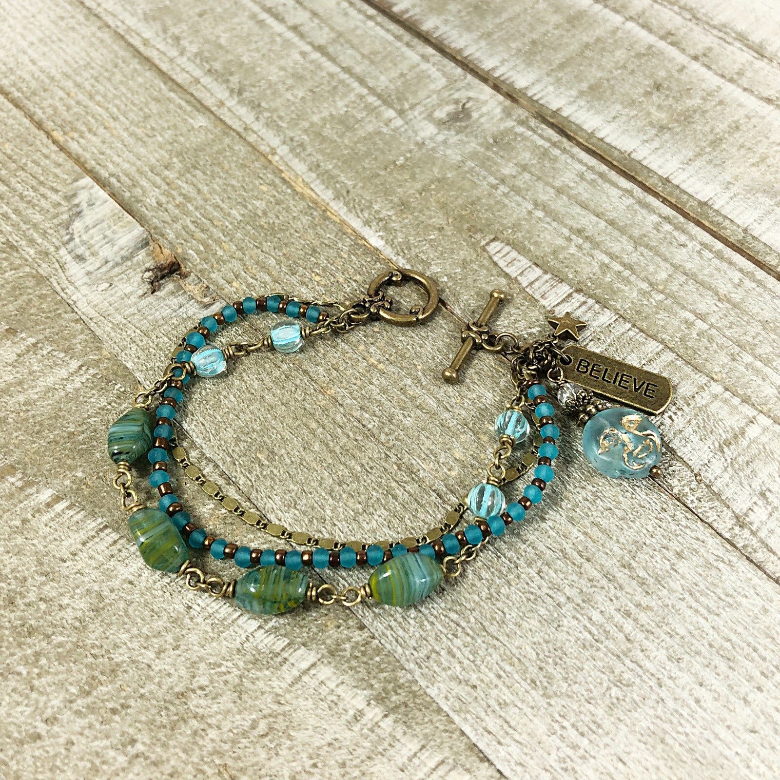 Boho Bronze Triple Strand Bracelet with Turquoise Hurricane Glass Beads