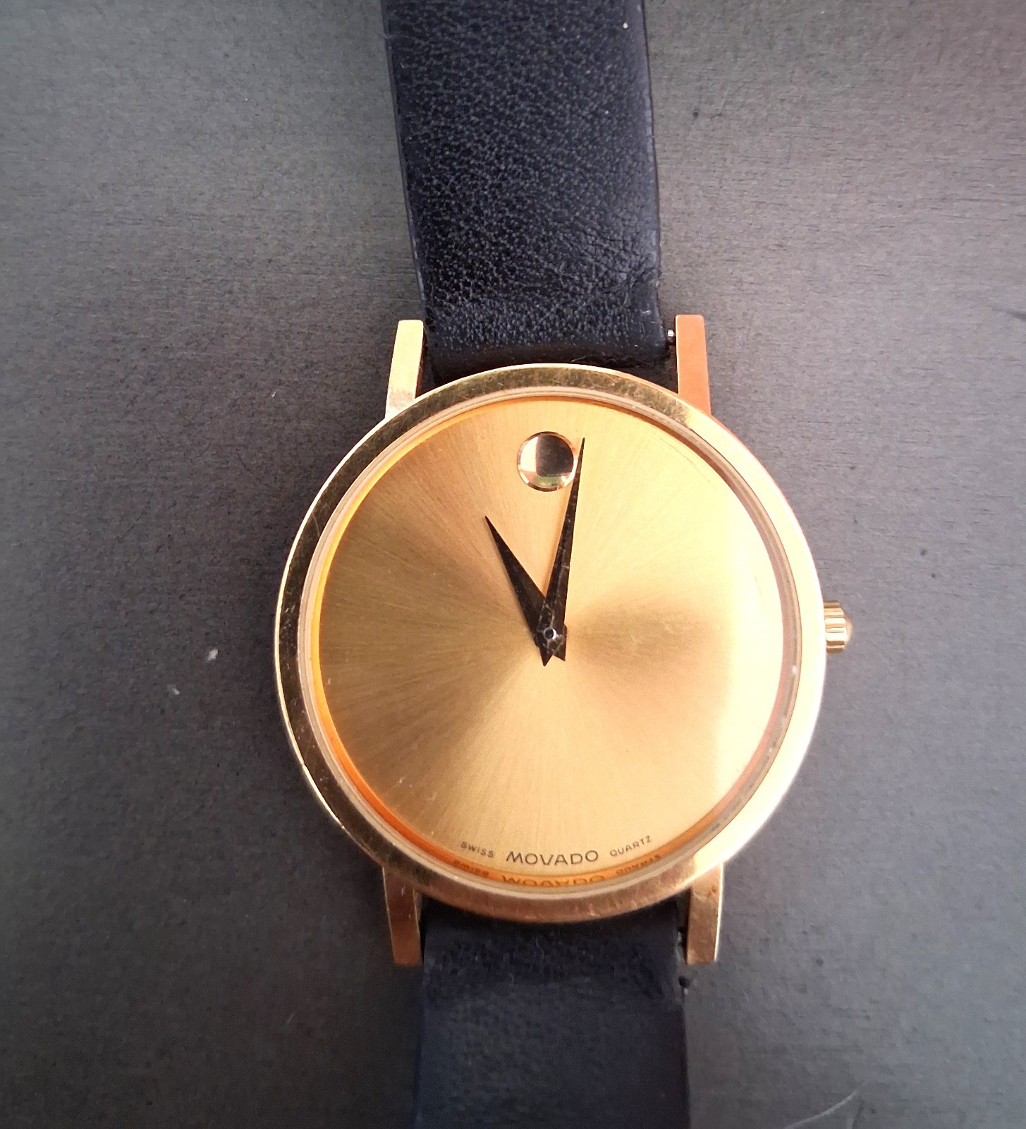 Movado Museum Wrist Watch for Men, gold face, black leather band, NEW Battery