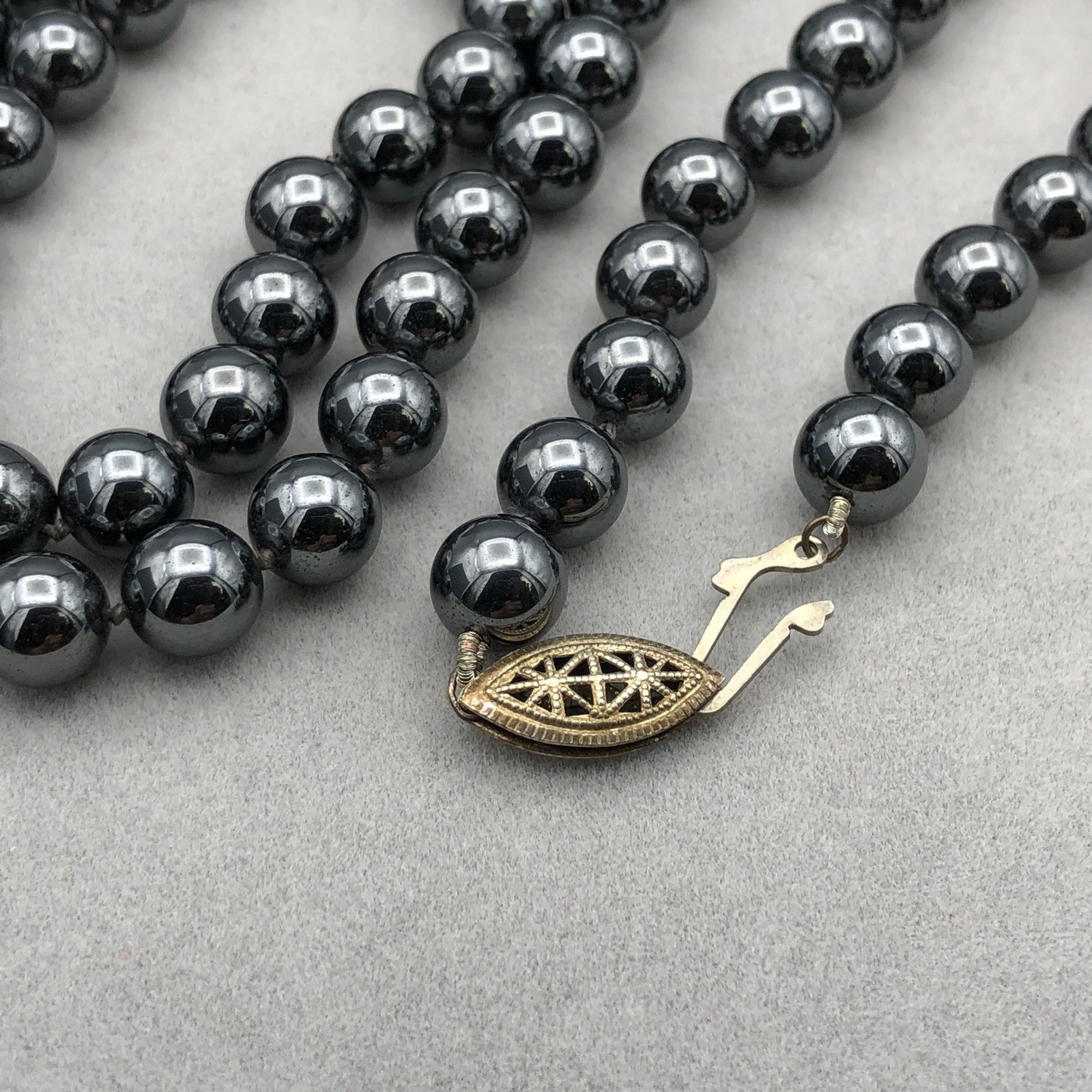 Vintage Hematite Bead Necklace 8mm Knotted 30 in Opera Length Filigree Clasp