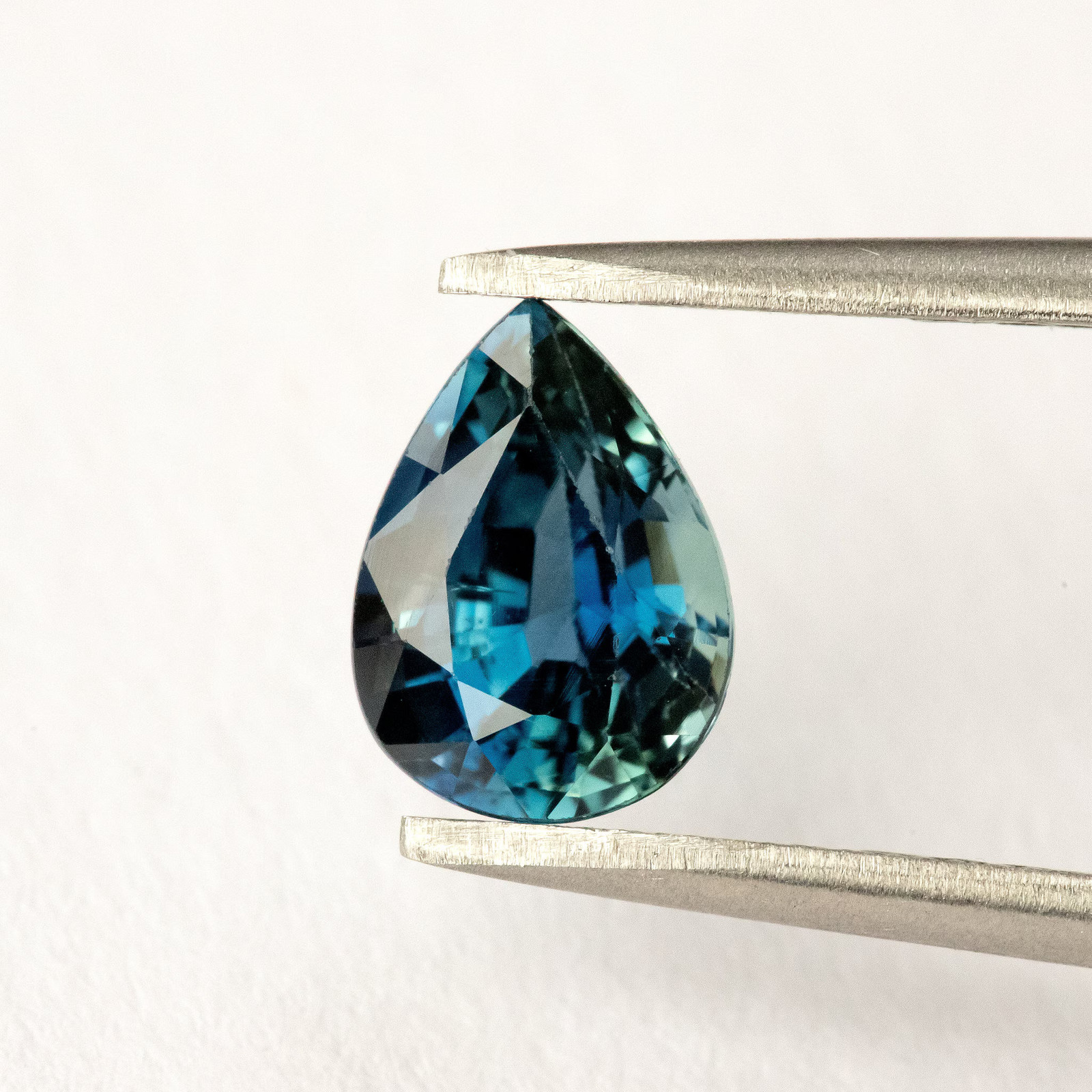 1.35ct Pear Shape Heated Natural Sapphire in Teal Green Peacock Blue Color