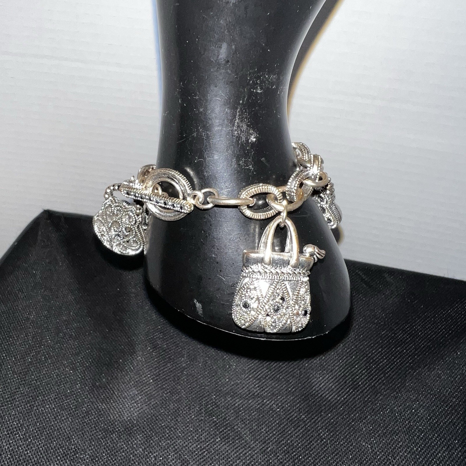 Silver-Tone Metal Puffy Openwork Purse Rhinestone Accent Charm Bracelet toggle
