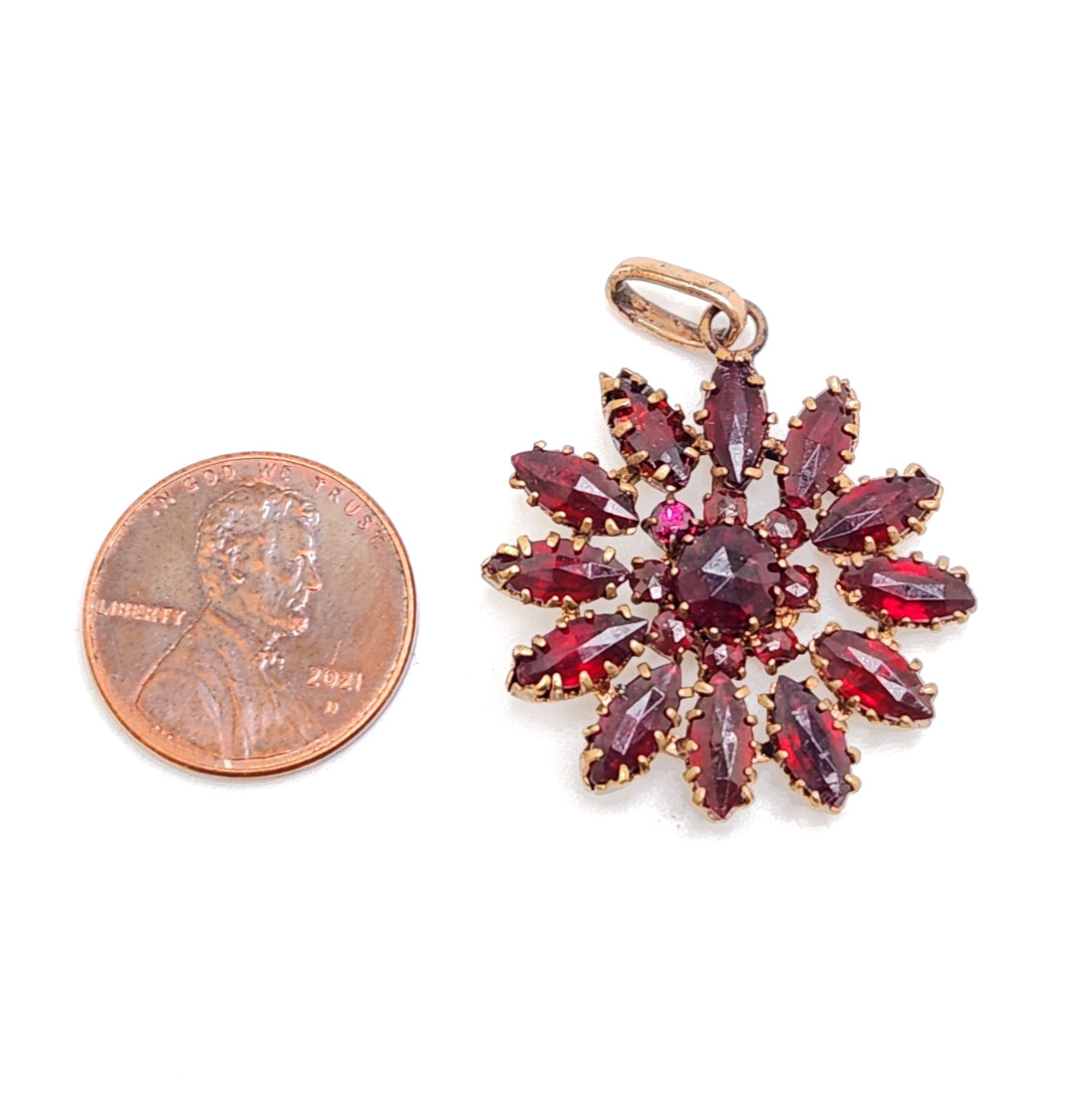 Vintage Gilt Metal Bohemian Red Glass Stone Starburst Floral Pendant 1 3/8″ Tall
