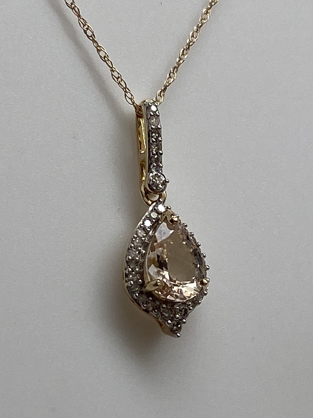 10K Yellow Gold Pear Shape Morganite and 0.11ct twt. Diamond Pendant with Chain