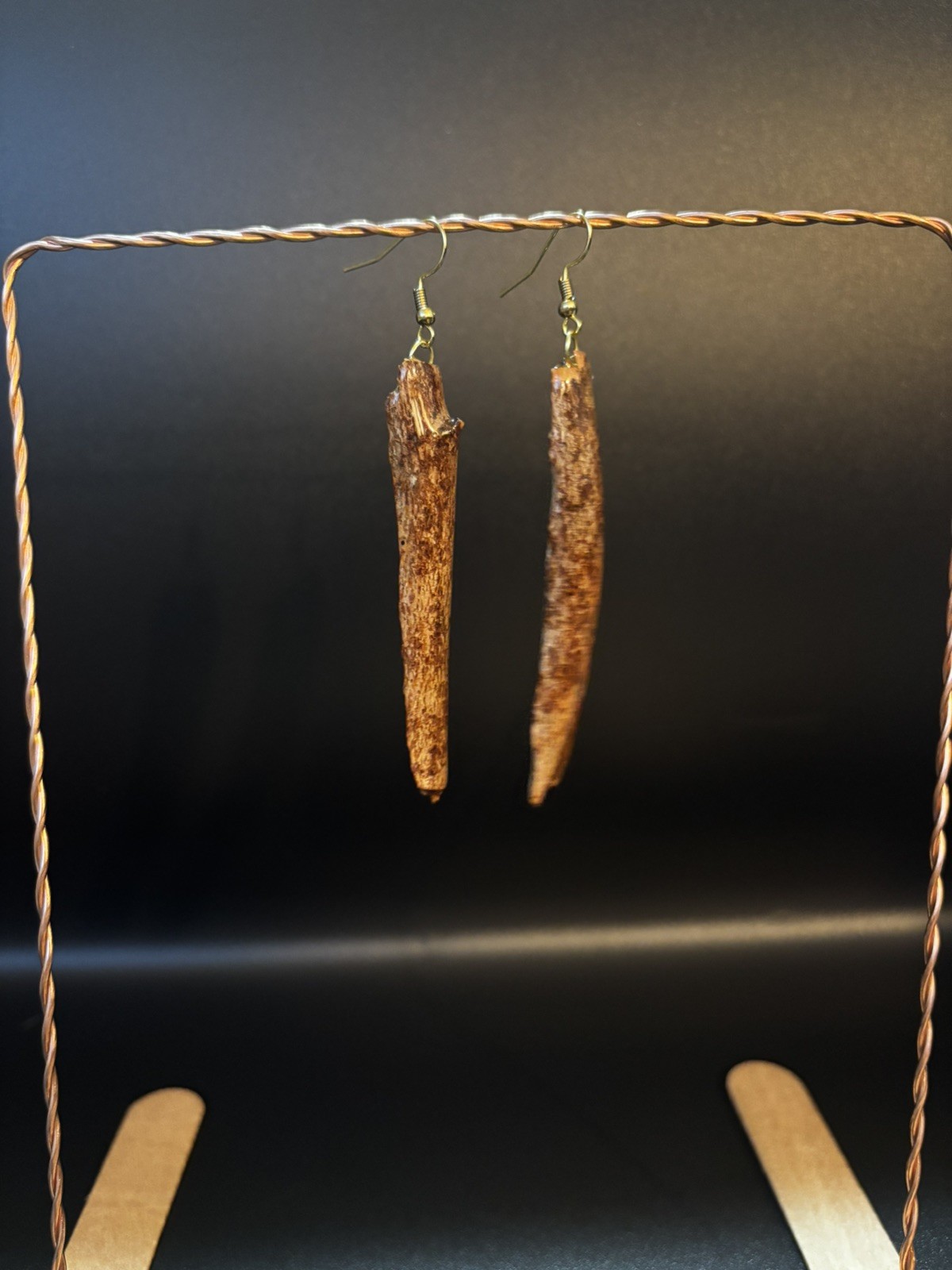 One of a kind jewelry made from real pieces of wood coated in resin