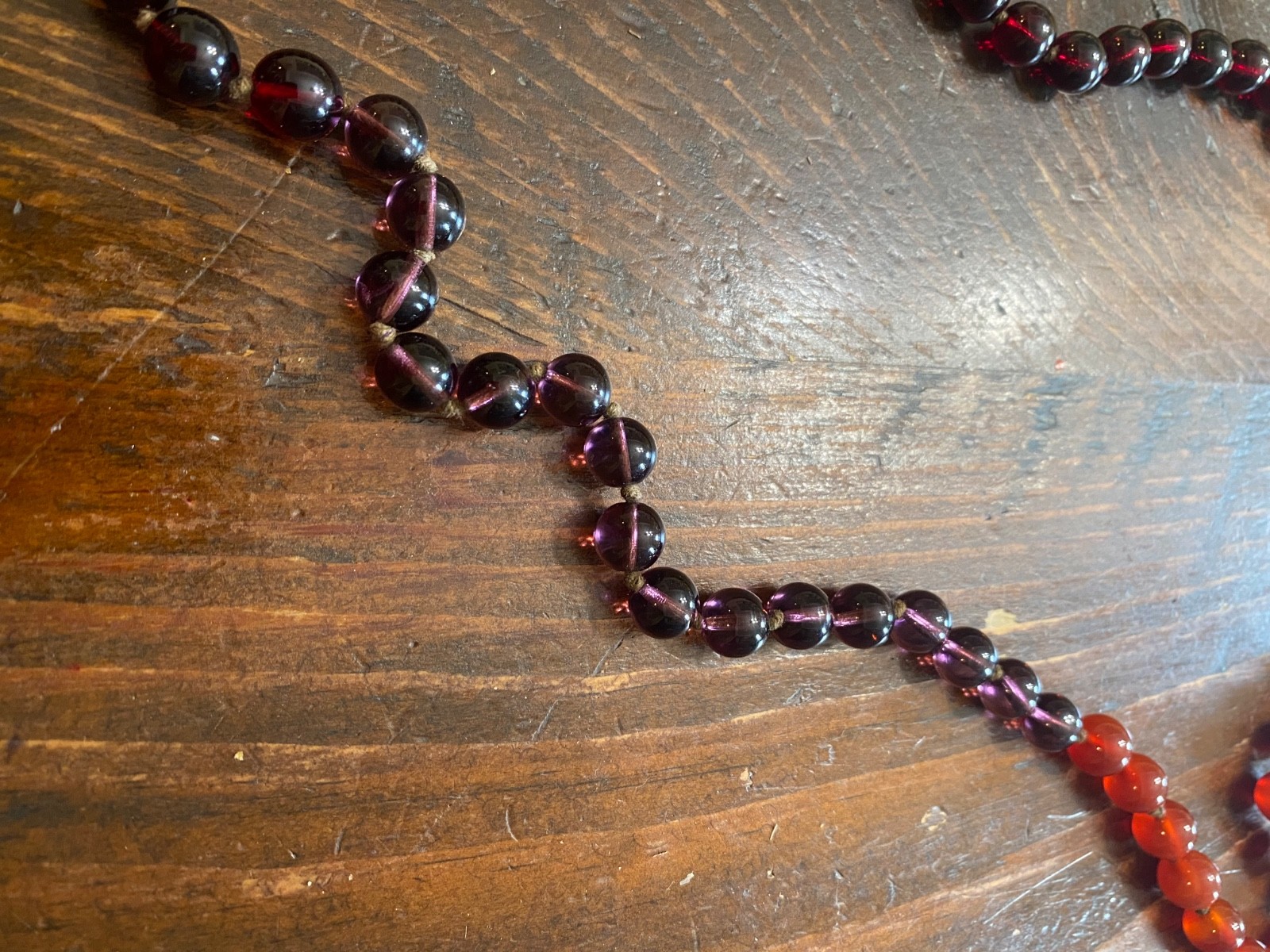 Vintage burgundy/purple/red ombre glass necklace with loop clasp and cording