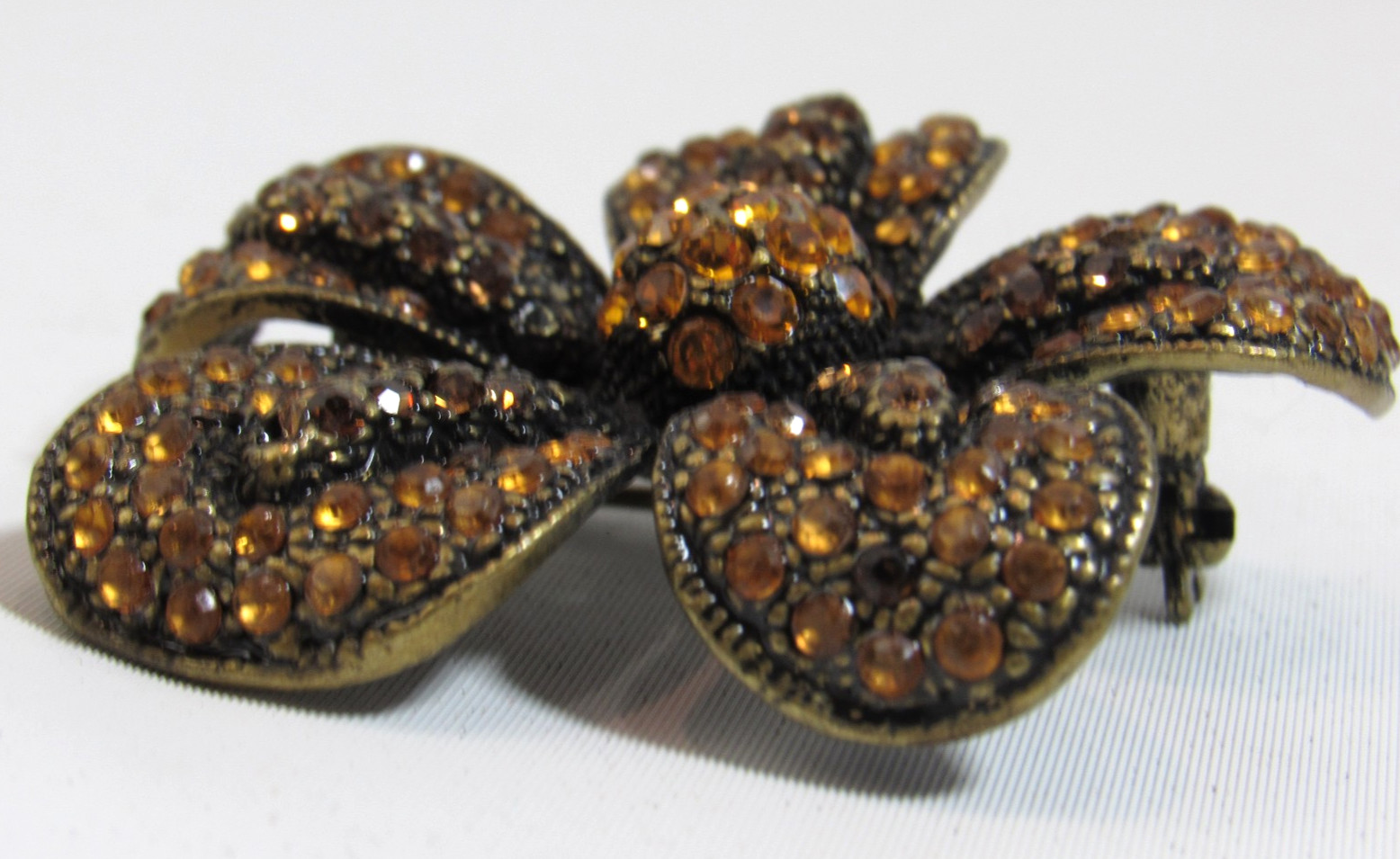 Vintage Erica Lyons Amber Rhinestone on Black Flower Brooch Pin