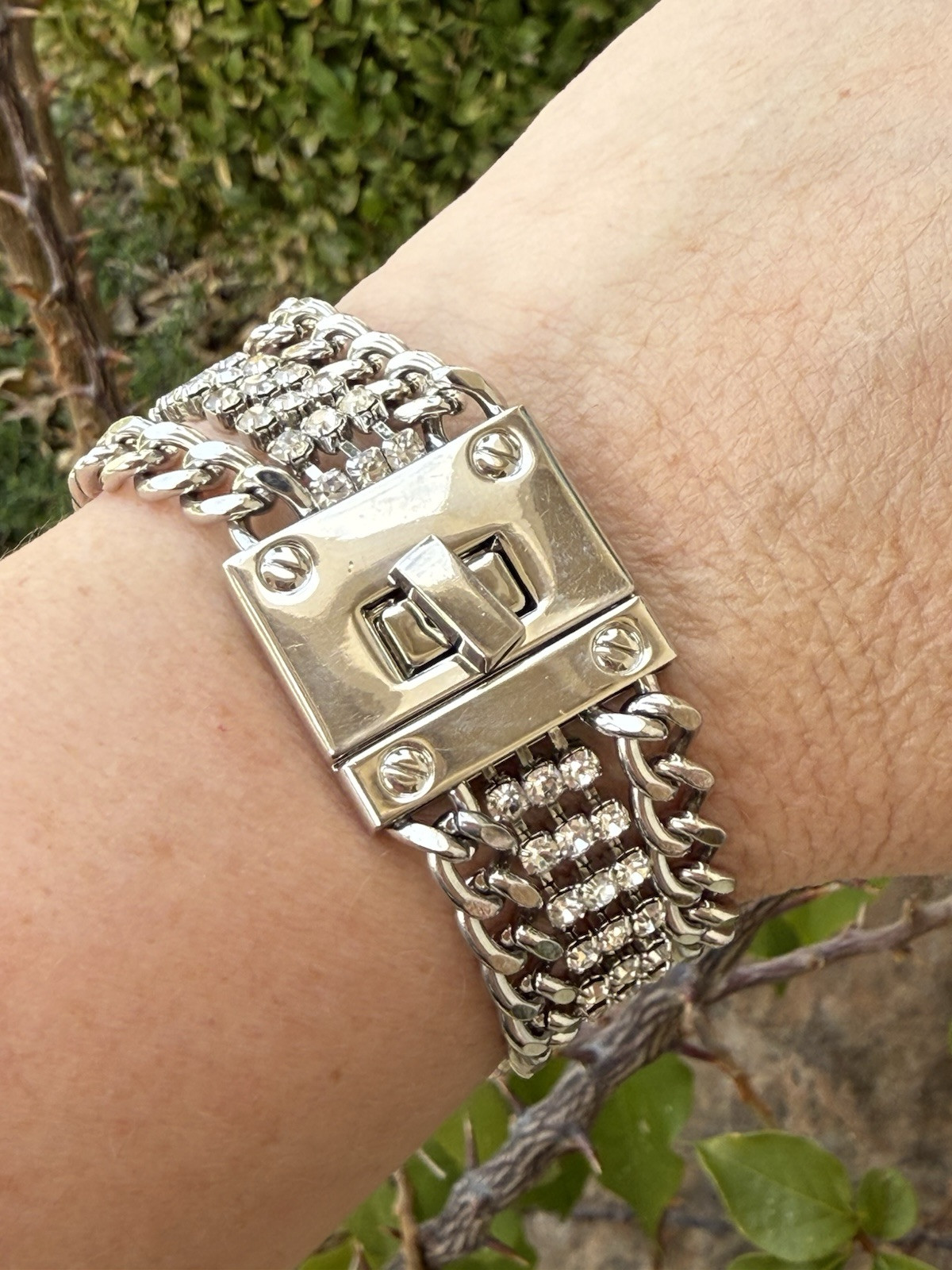 Silver Triple Link Turn Lock Chain Bracelet With Center Rhinestone Details