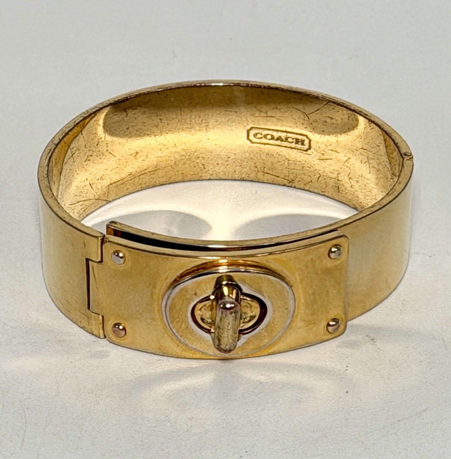 Coach Shiny Gold Turn Lock Bracelet Bangle Opens closes 3/4″ Thick