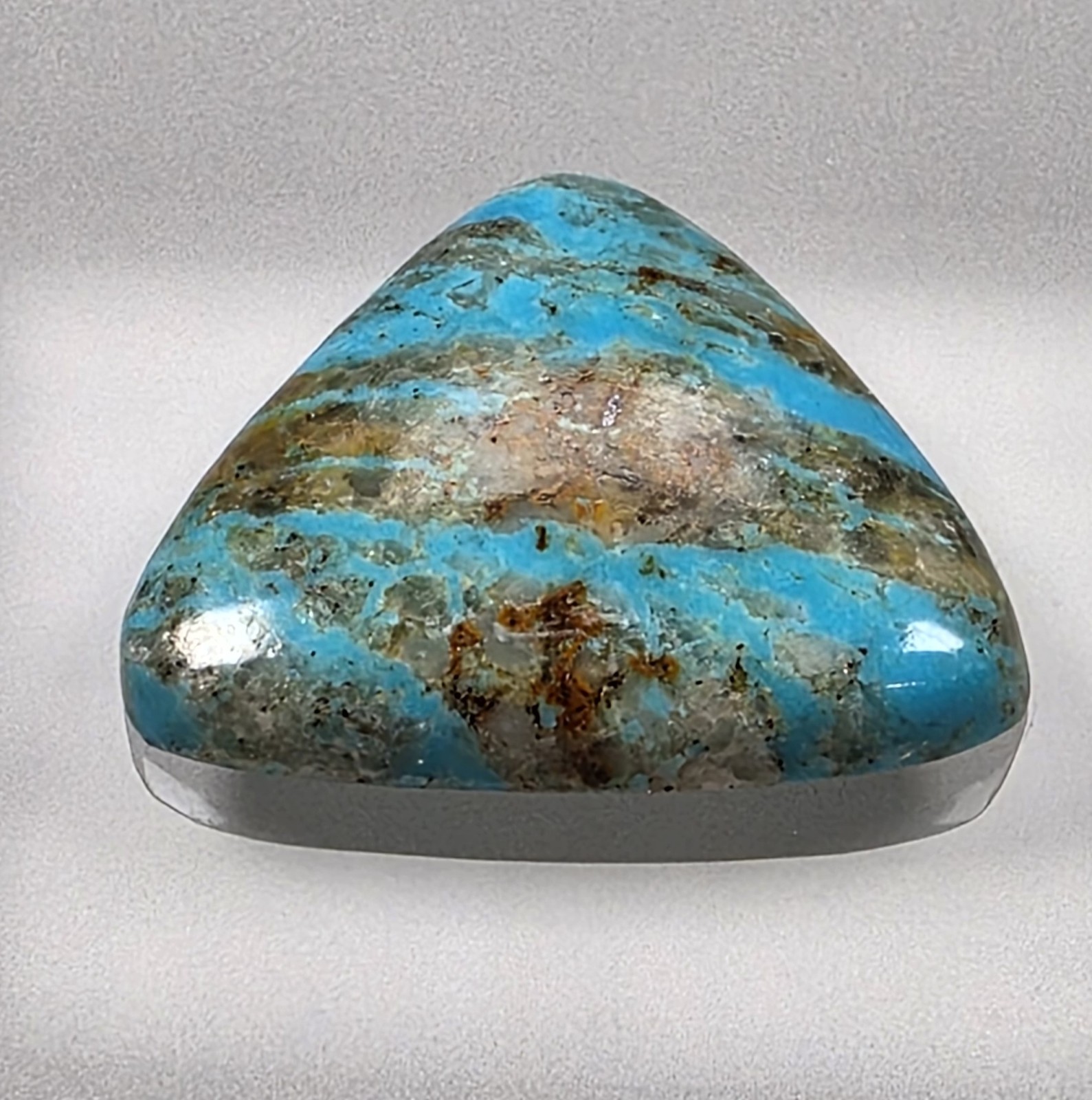 Kingman turquoise cabochon, boulder pattern, trillion cut, 30.49 carats, #B23