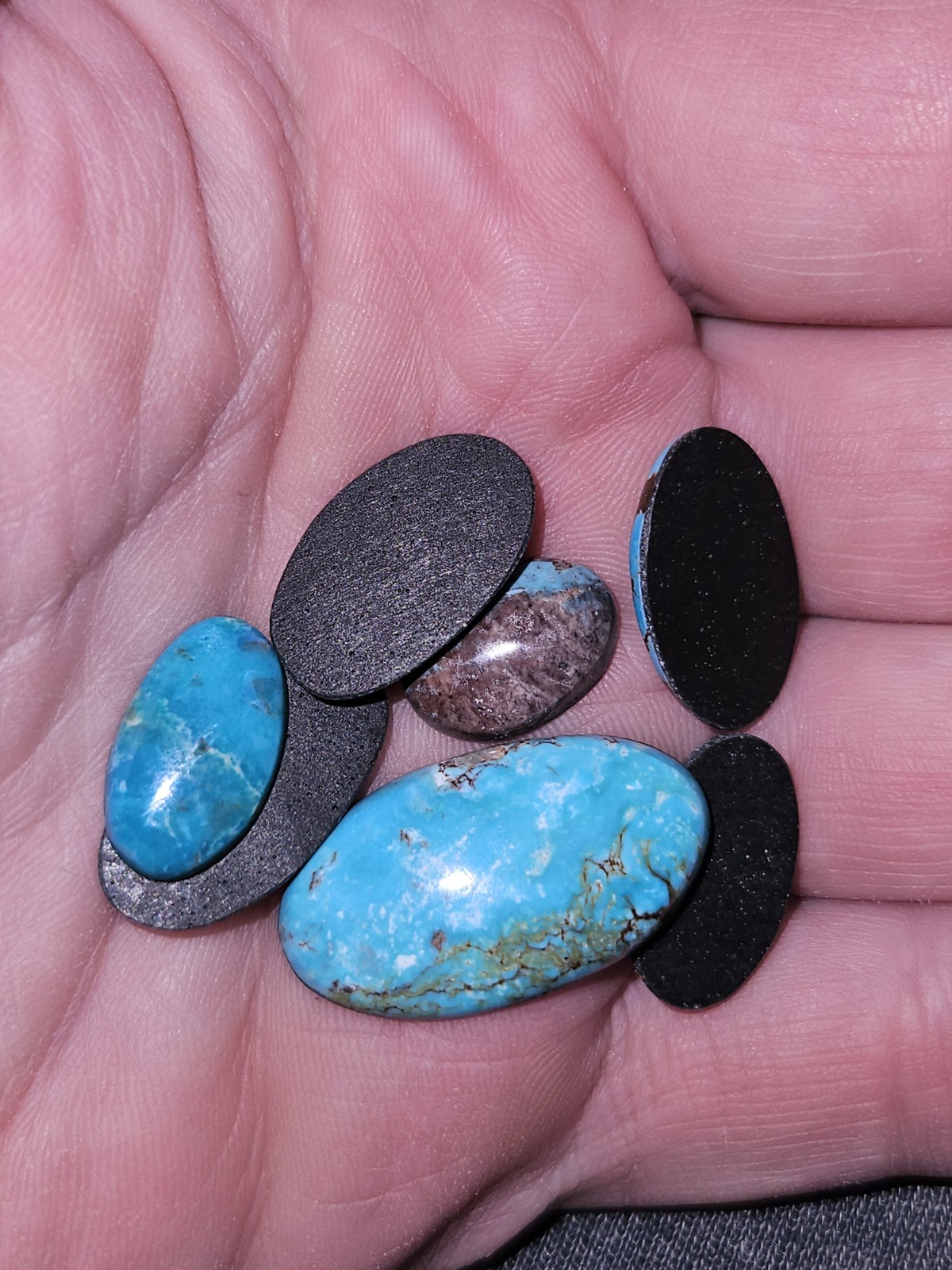 Rare Bisbee Turquoise Ovals – Backed – 7 pieces – 48.905 carats total