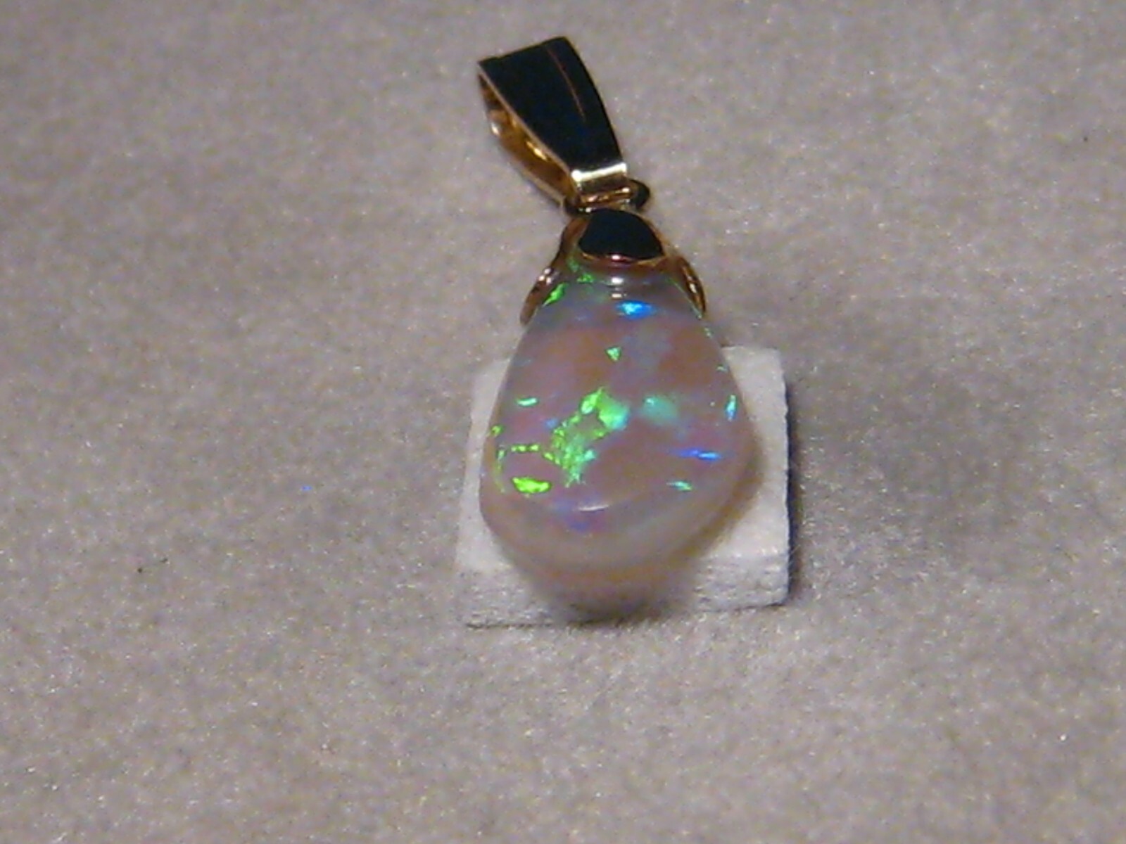 .90 ct. small Bright Opal Pendant , Solid 14 k yellow gold