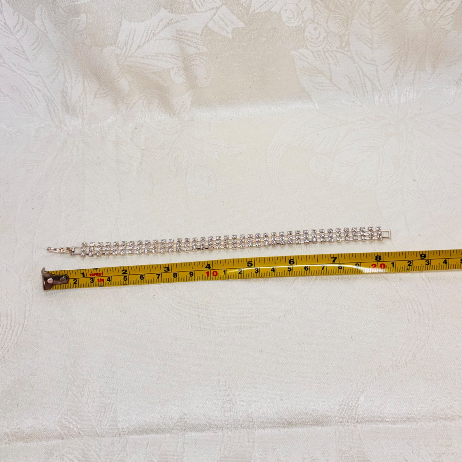 BRACELET vintage rhinestone triple row silvertone metal fold over clasp 7 1/2″ c
