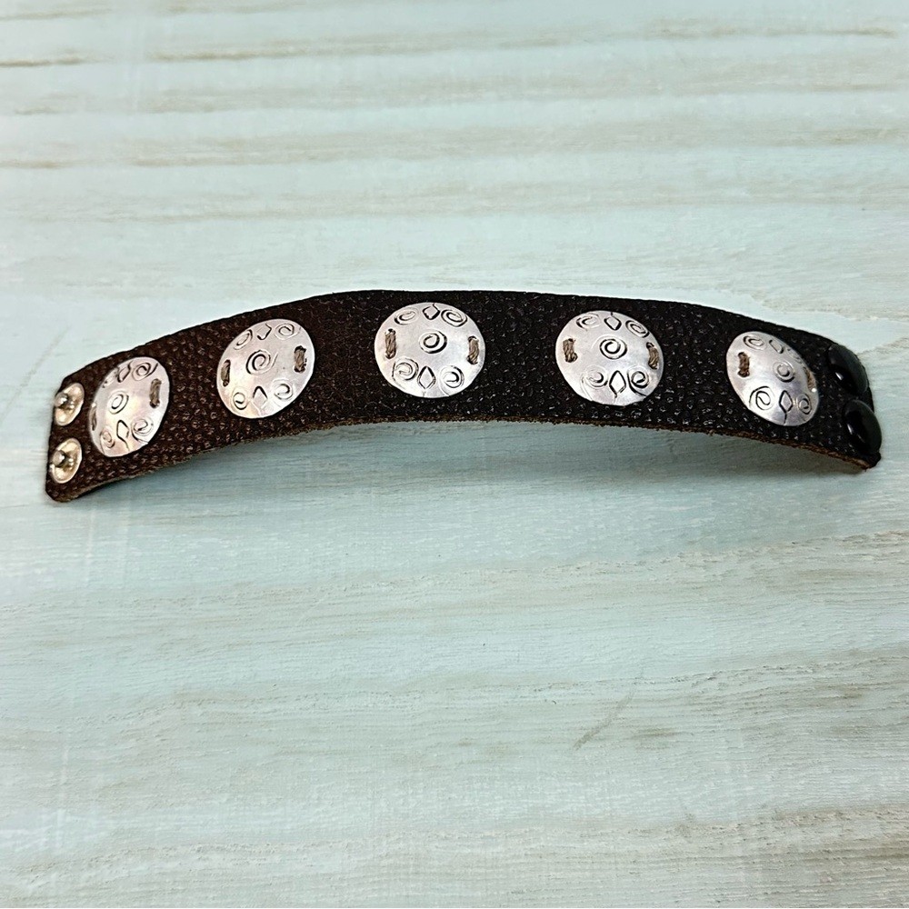 Textured leather leather bracelet with silver hammered discs