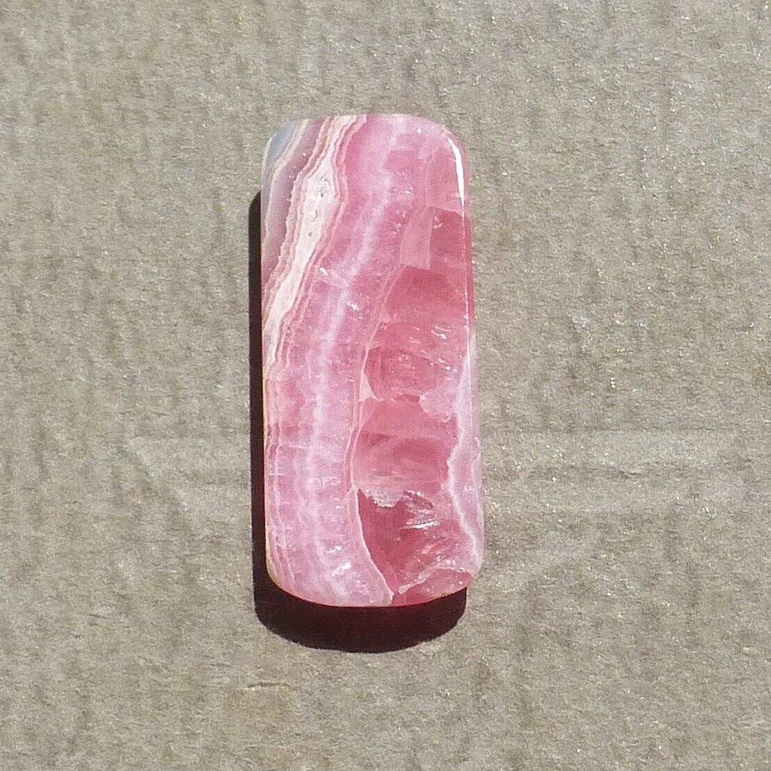 Pink w/calcite banding natural Rhodochrosite cabochon Argentina (27.60 carats)