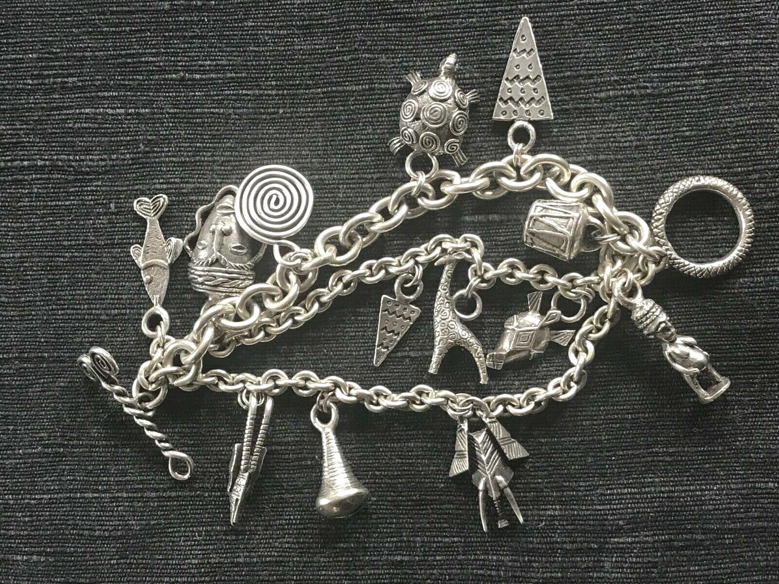 SUSAN CUMMINGS. SS 3 ROW HEAVY LINK BRACELET. 170 GRAMS. ENDANGERED SPECIES