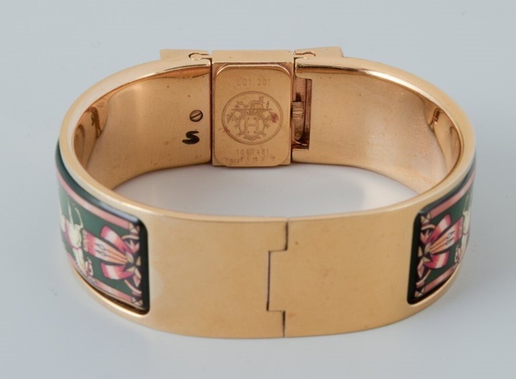 Hermes, ladies’ wristwatch. Made of gilded metal and enamel work.