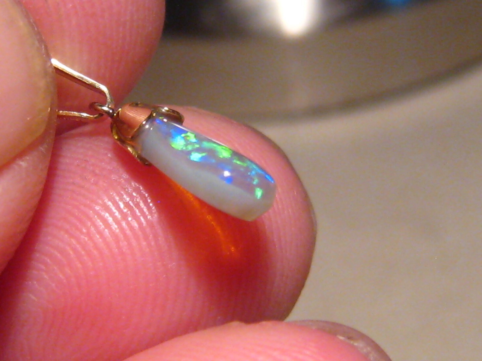 .90 ct. small Bright Opal Pendant , Solid 14 k yellow gold