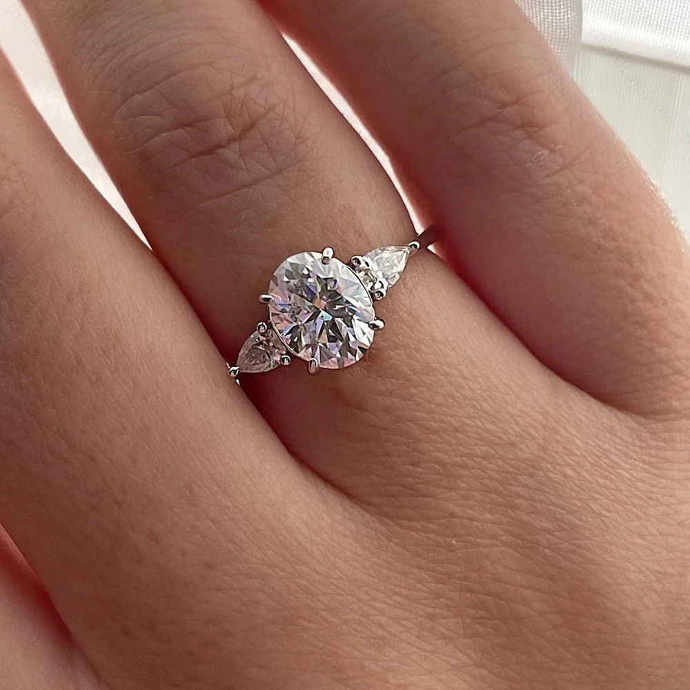 3.10 TCW Oval Cut Moissanite Three Stone Engagement Ring 14K White Gold Plated