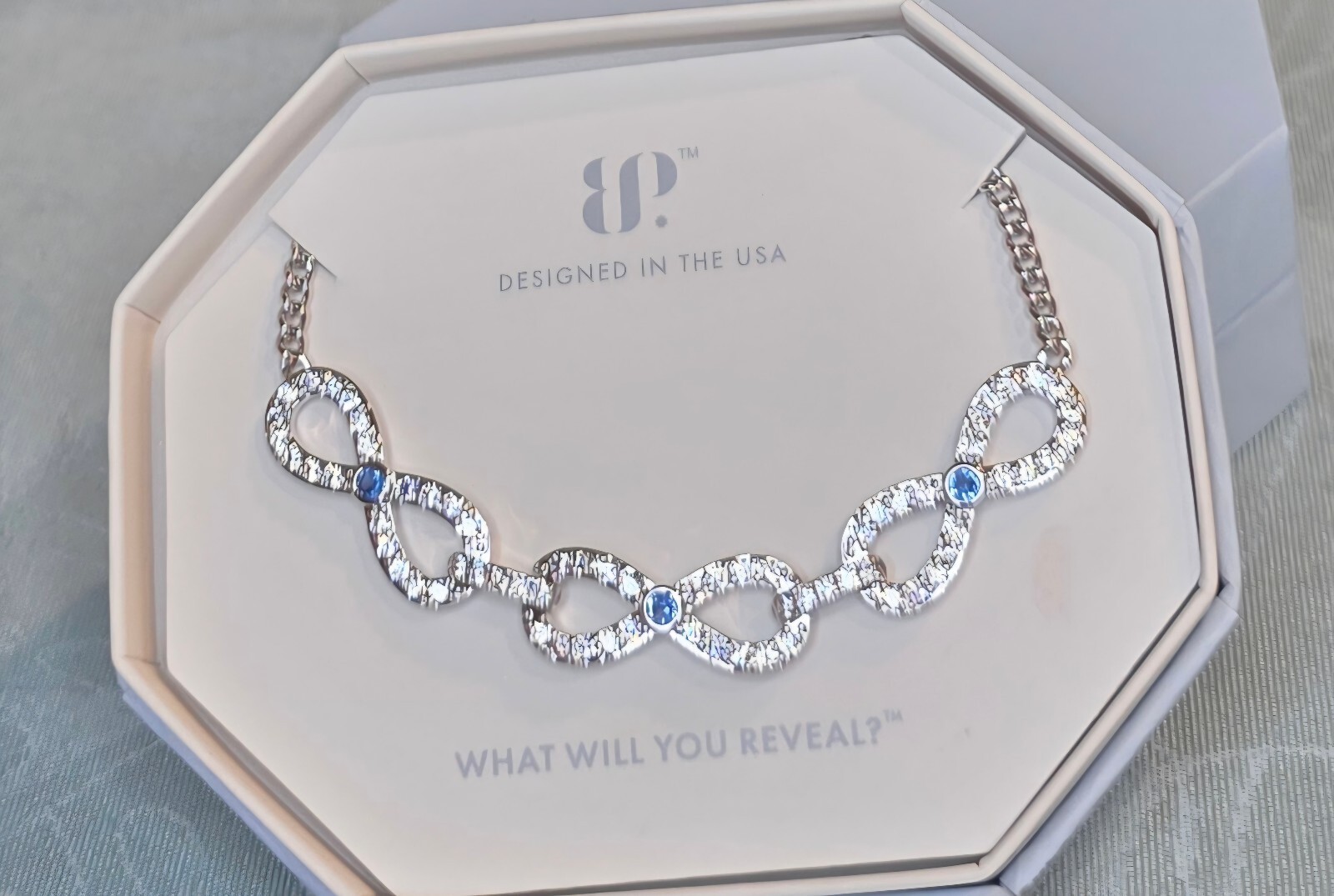 BP Infinity Bound Rhodium Plated Necklace with Aqua Blue Lab