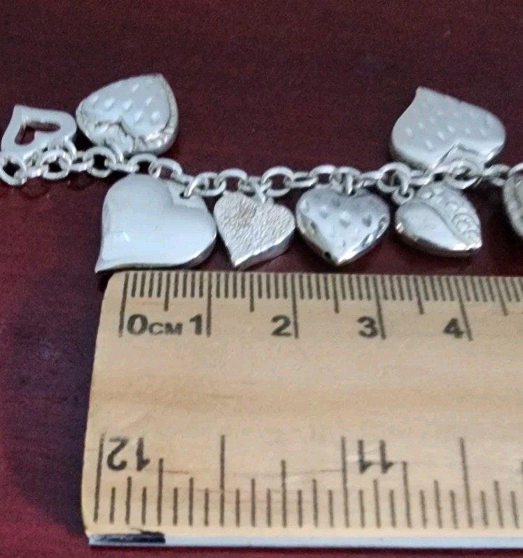 JCM 925 STERLING SILVER HEART CHARMS BRACELET. 8″. 20.80GRS. MADE IN MAURITIUS