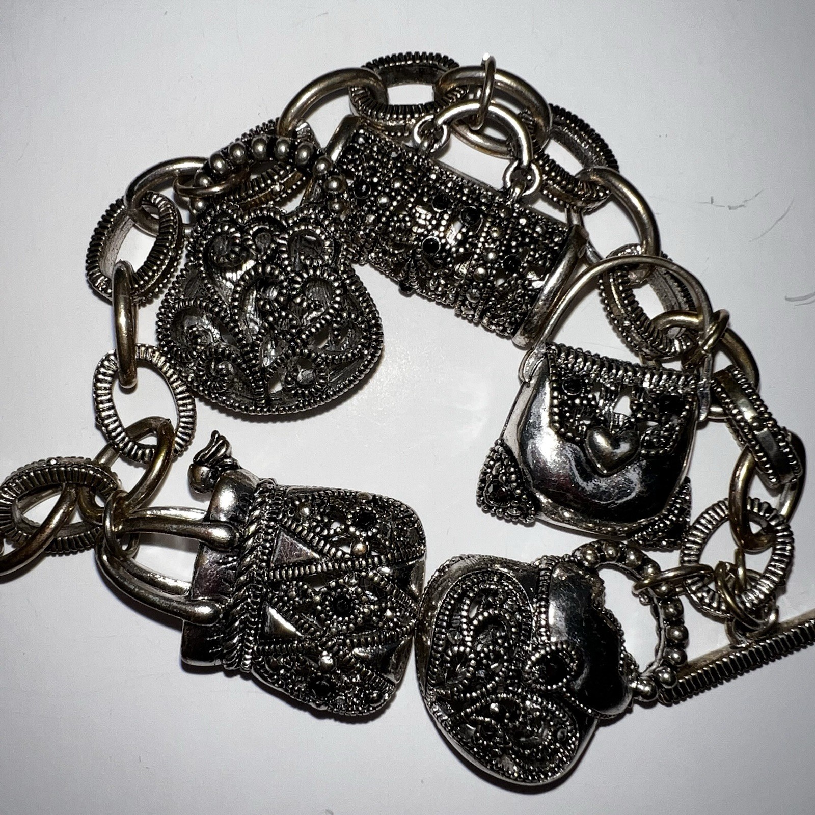 Silver-Tone Metal Puffy Openwork Purse Rhinestone Accent Charm Bracelet toggle