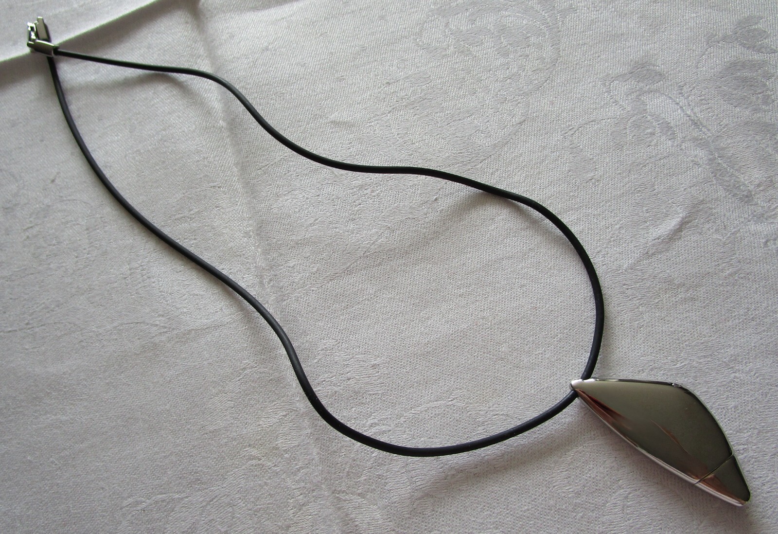 LOTUS STYLE Stainless Steel Triangle Ornament Rubber Cord New in Box Never Worn