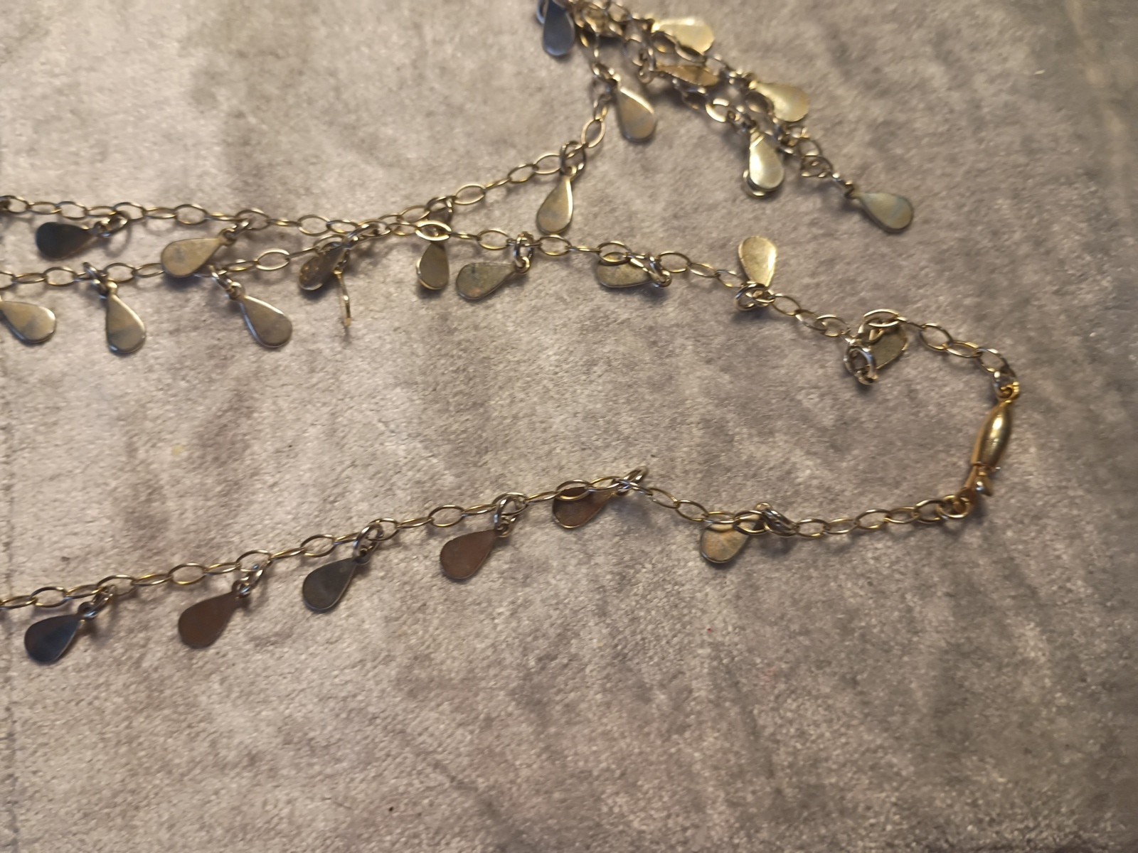 Gold Toned Tear Drop Charmed 56 Inch Taper Single Strand Necklace. J2