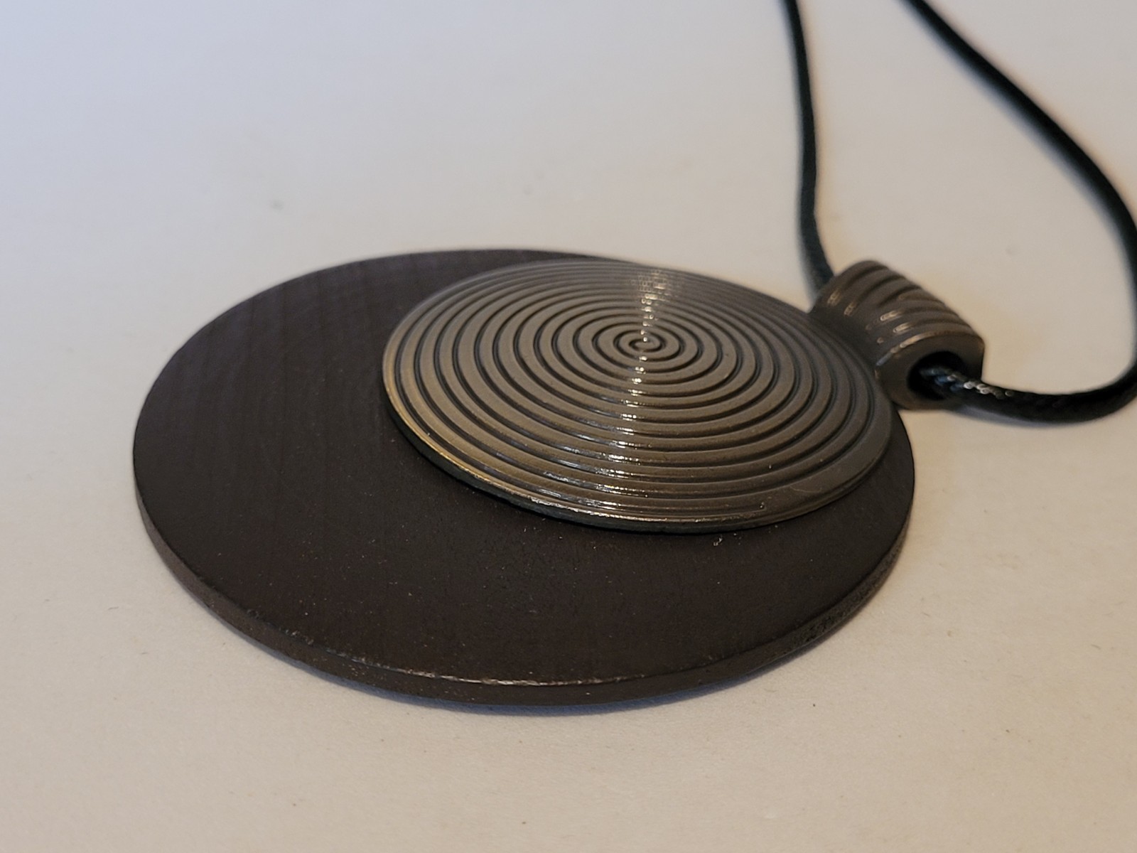 New Large Round Wooden And Metal Spiral Pendant On A Black Cord Type Chain