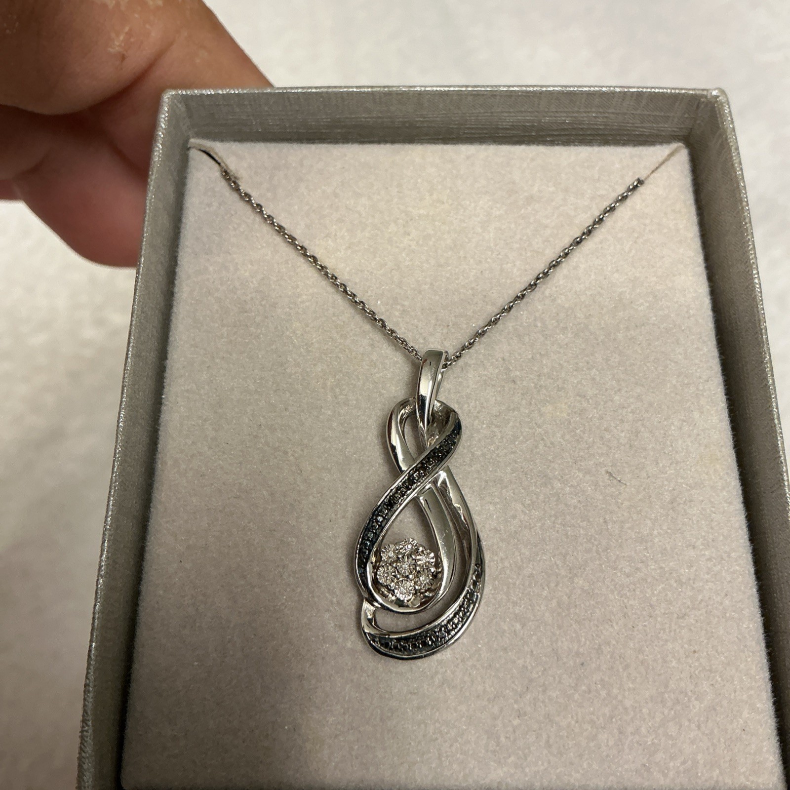 Zales Sterling Silver Diamond Accent 7 Stone Infinity Pendant Necklace, 18″ 3601