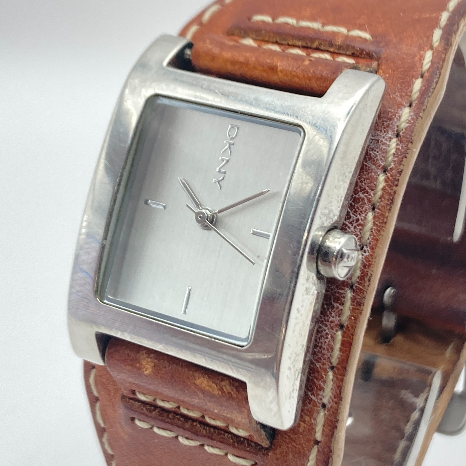 DKNY Women’s Watch 24mm Silver Tone Brown Leather Cuff 30M Tank New Battery 8″