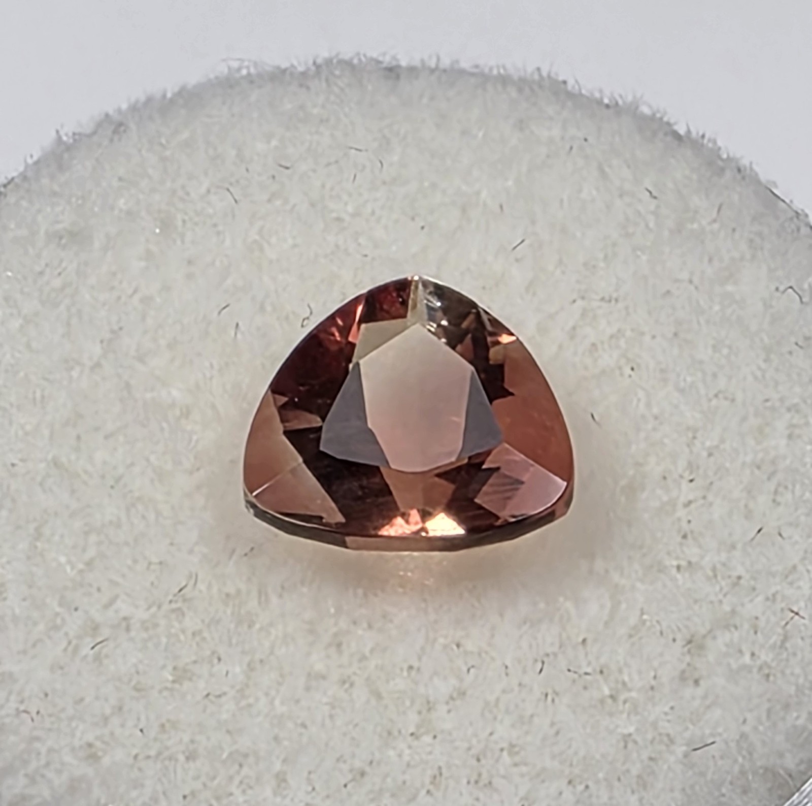 1.72 ct Oregon Sunstone –Trillion Cut – Reddish Orange Color Center Under Table