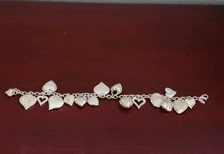JCM 925 STERLING SILVER HEART CHARMS BRACELET. 8″. 20.80GRS. MADE IN MAURITIUS