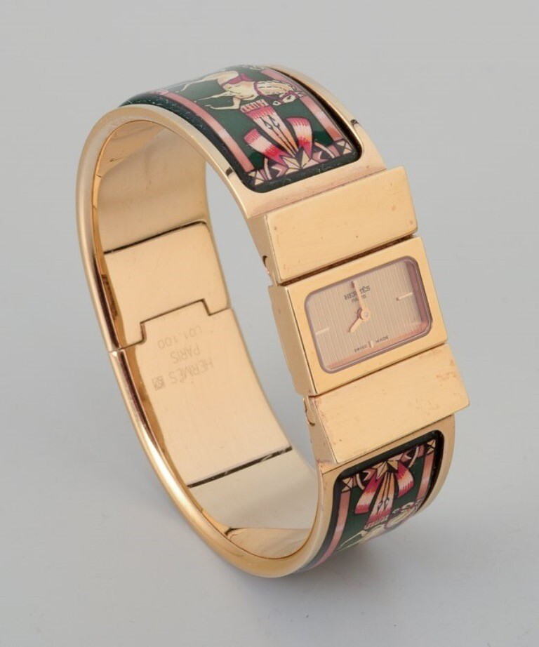 Hermes, ladies’ wristwatch. Made of gilded metal and enamel work.