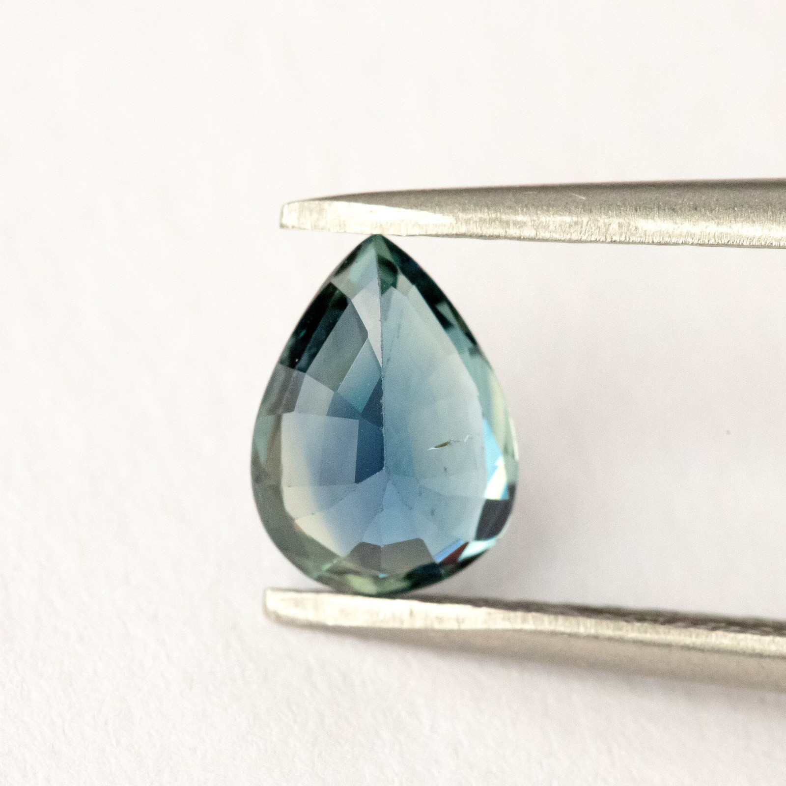 1.35ct Pear Shape Heated Natural Sapphire in Teal Green Peacock Blue Color